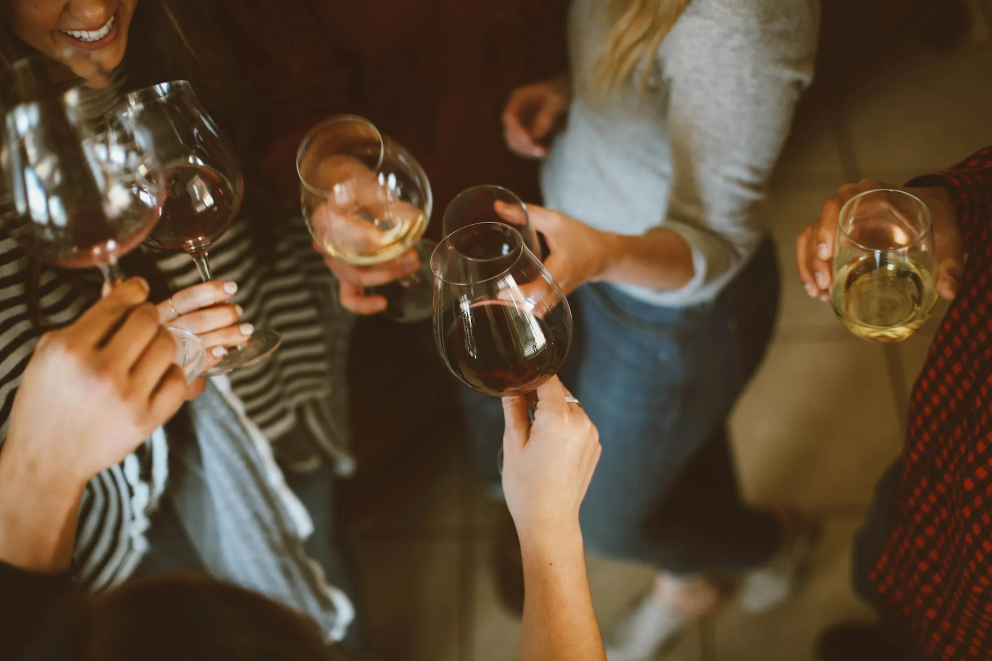 Friends clinking glasses of wine