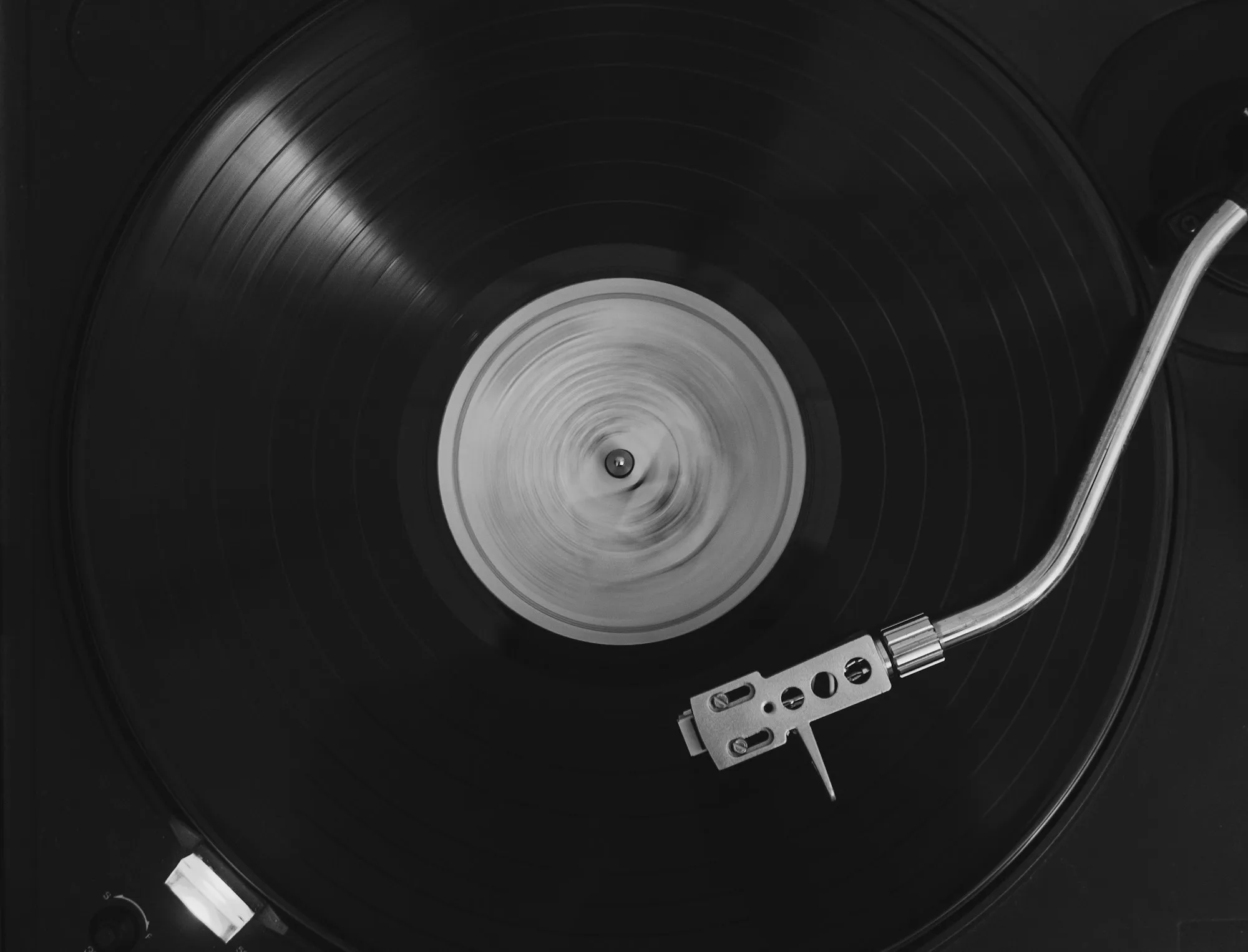 A vinyl record spinning on a turntable