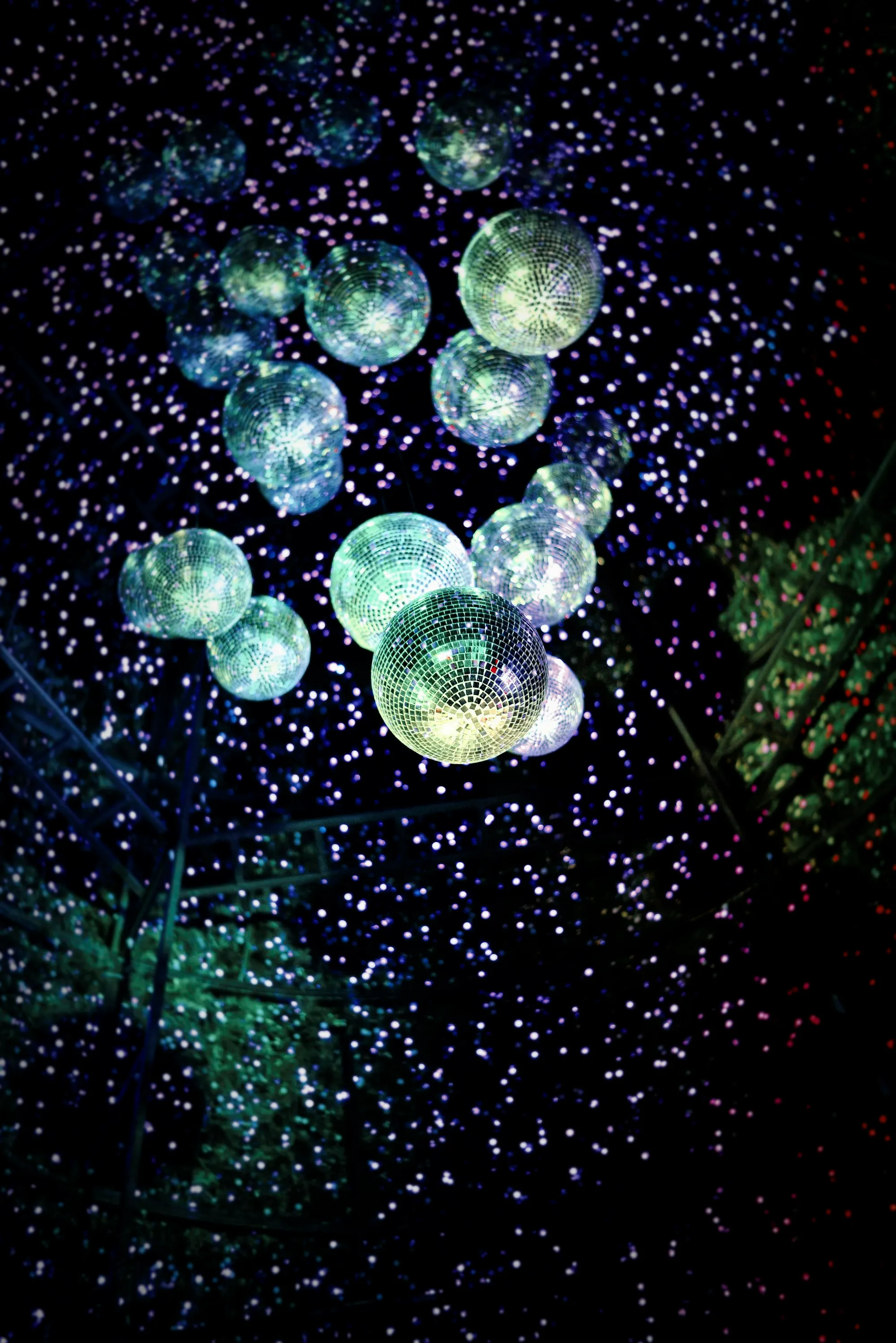 Mirror balls glittering among tiny lights